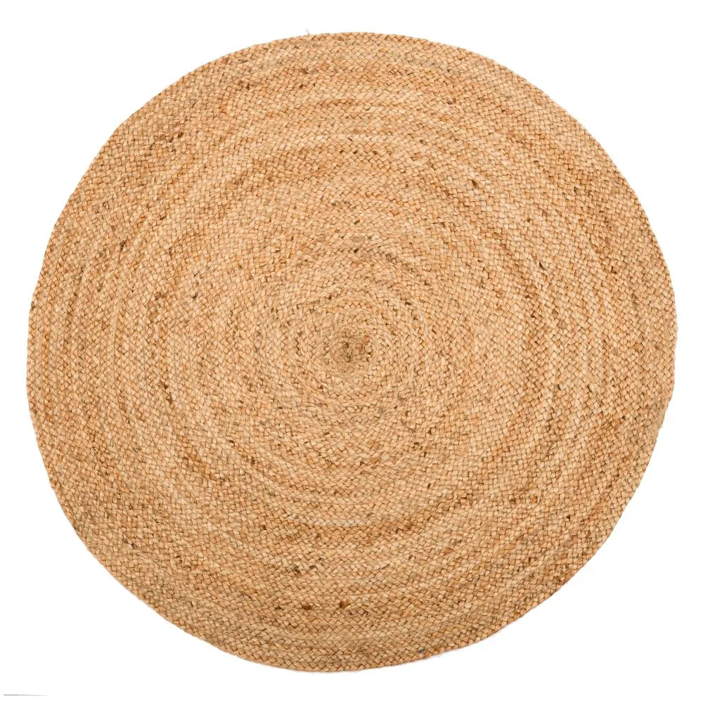 A handwooven beige jute round rug on a white background.