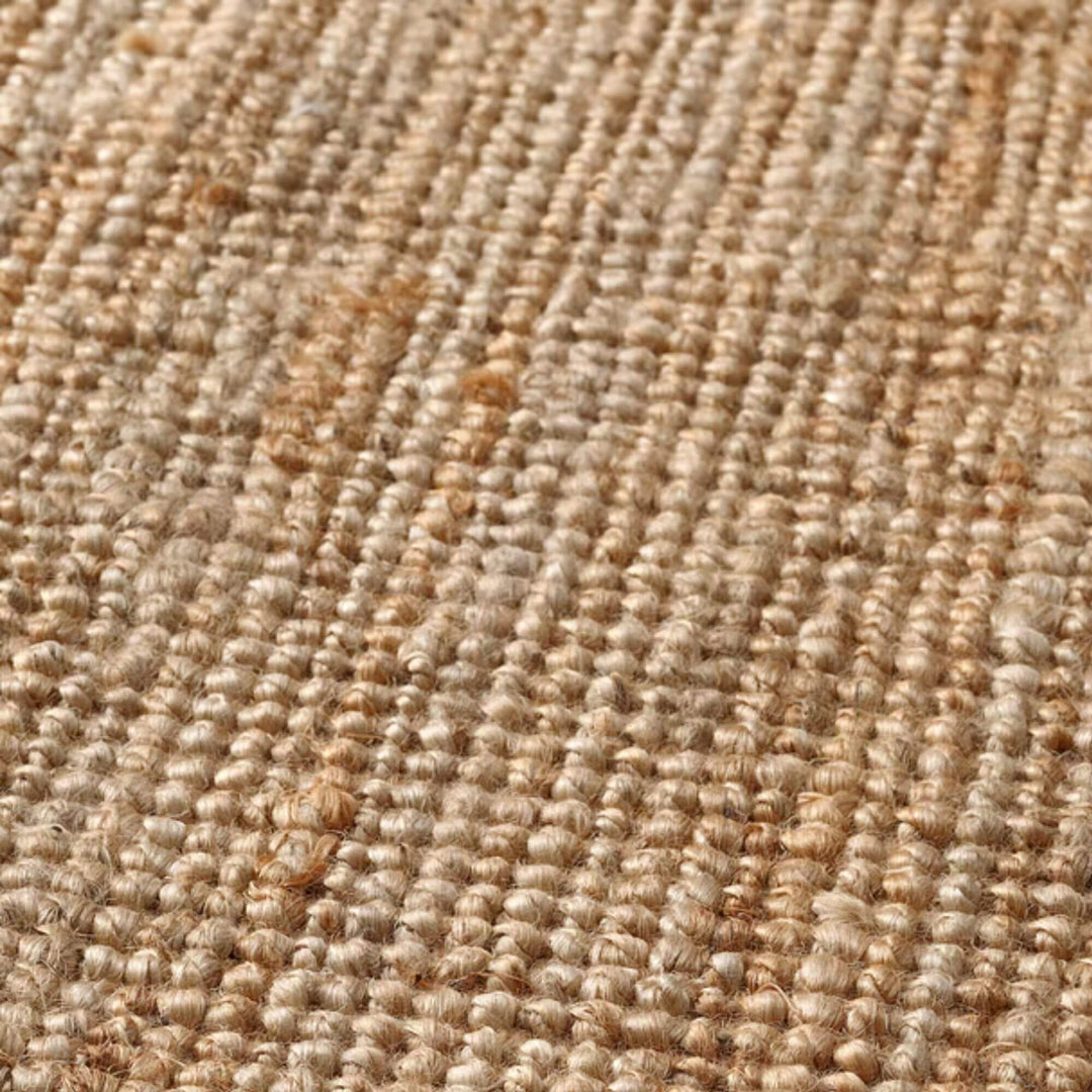 Detailed view of the natural jute weave showing its earthy tones and organic fiber texture