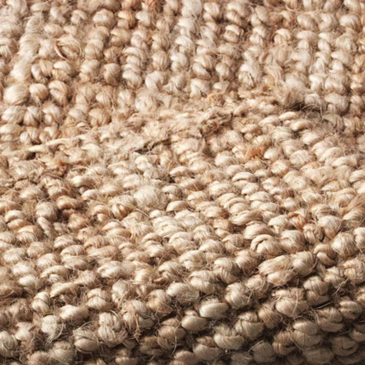 Close-up of the jute rug highlighting its thick natural fibers and textured woven surface