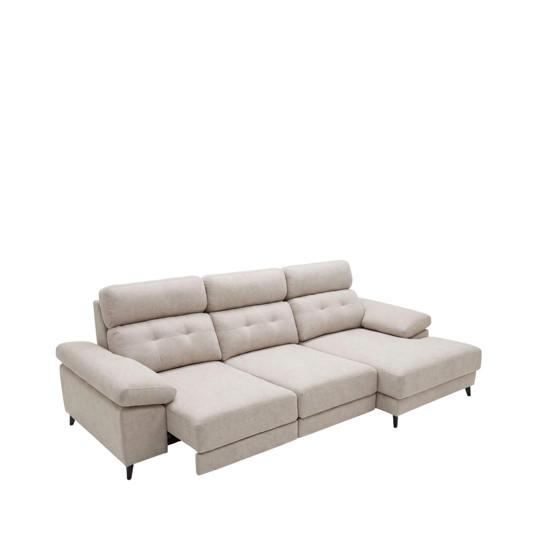 Front view of the Kairo extendable sofa showing its soft neutral upholstery and spacious chaise-style design.