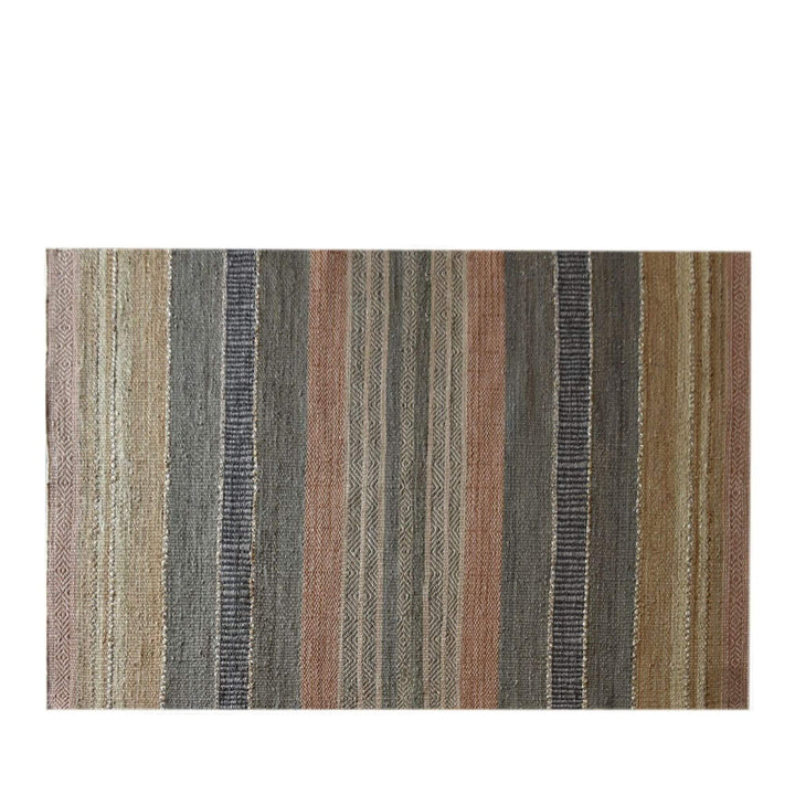 Front view of the Kakolem rug with vertical multicolor stripes in earthy natural tones.
