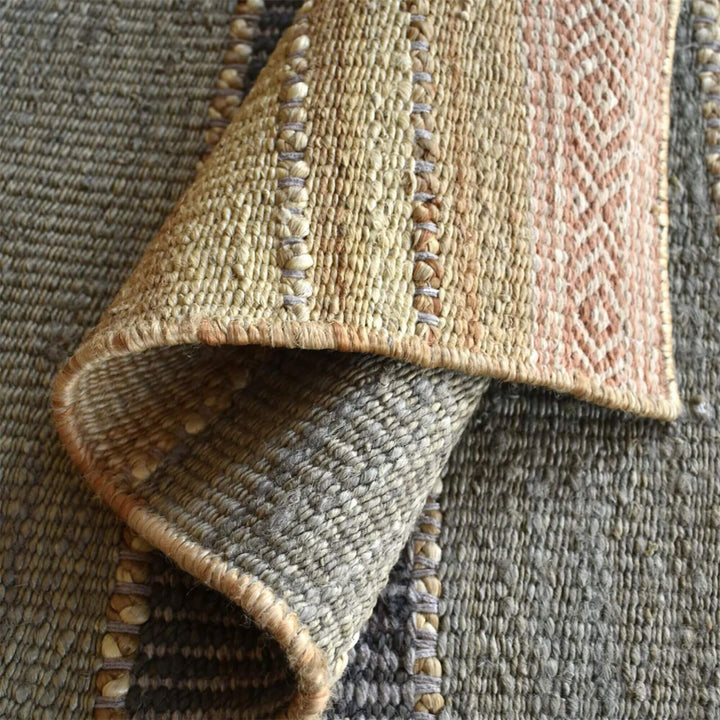 Folded corner detail of the Kakolem rug highlighting thickness and artisanal finish.