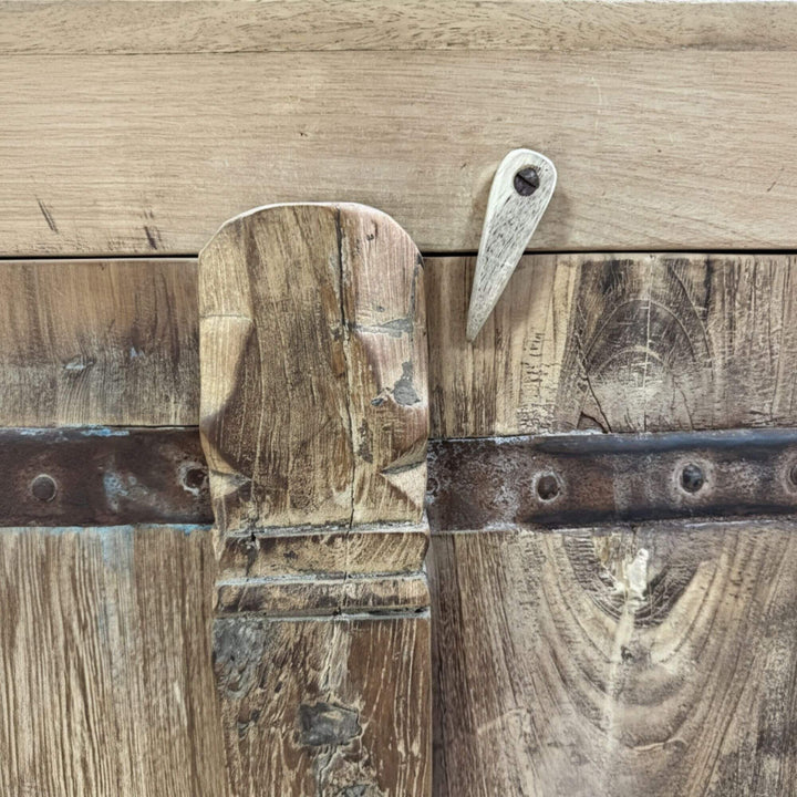 Detailed view of the aged wood texture with visible grain and patina.