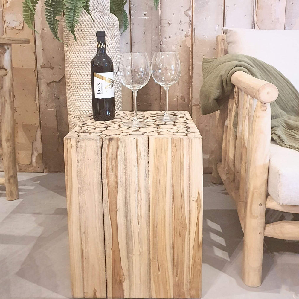Kalimnos teak side table styled as a drink stand in a cozy corner