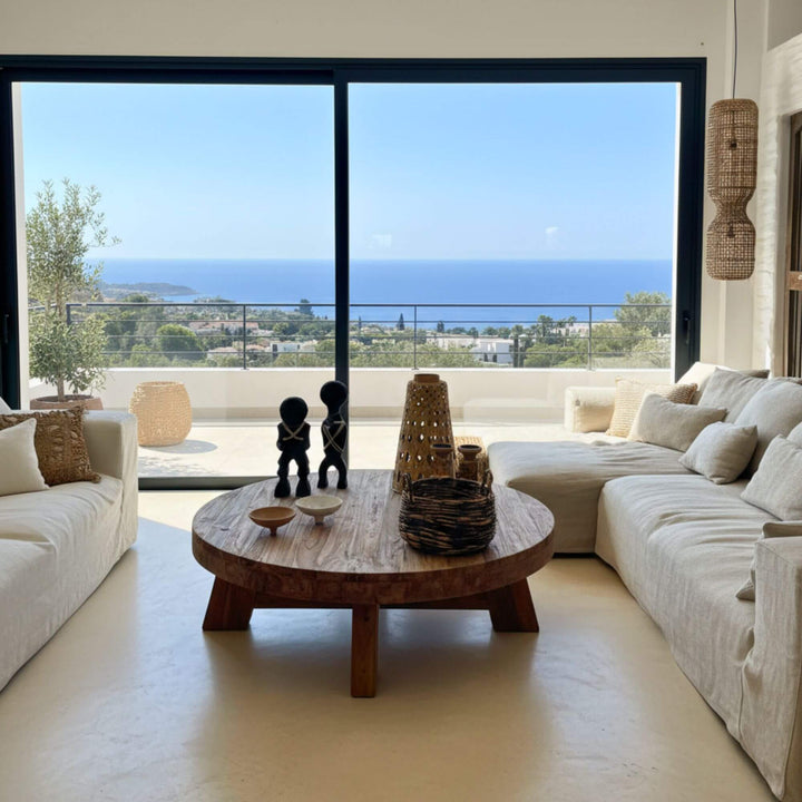 Living room setting featuring the round recycled teak Kalon Coffee Table.