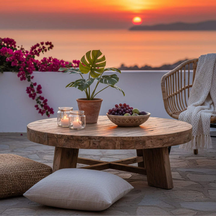 Outdoor sunset scene with the Kalon recycled teak wood coffee table.