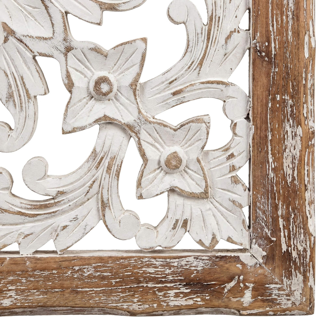 Close-up detail of the carved teak wood design with distressed white finish.