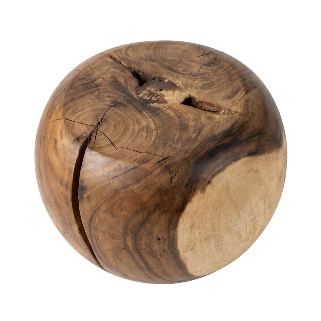 Front view of the Karas suar wood stool showing its rounded sculptural shape and natural wood grain.