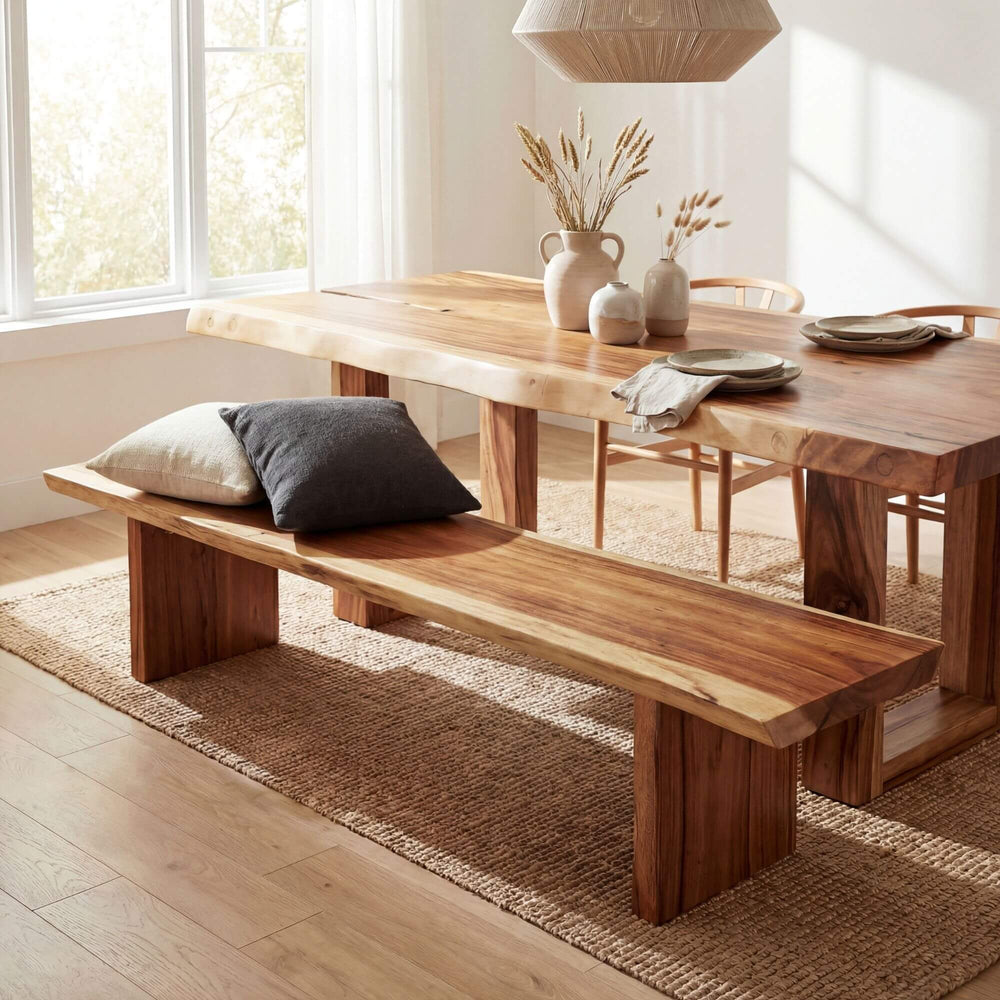 Dining room setting featuring the Karimata wooden bench beside a table.