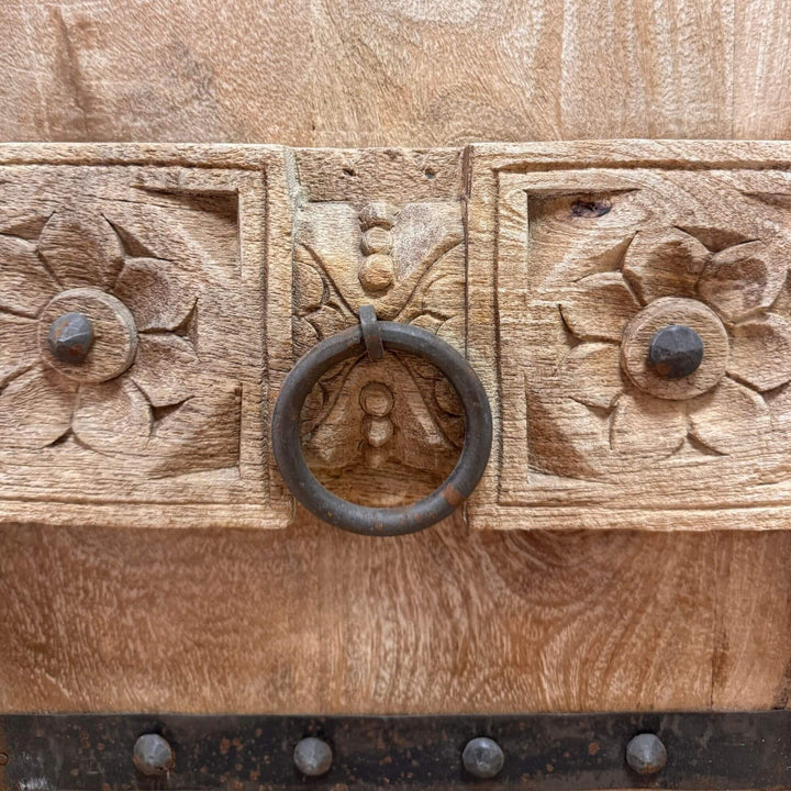 Close-up of the carved wooden door and metal ring handle on the Kasol Buffet.