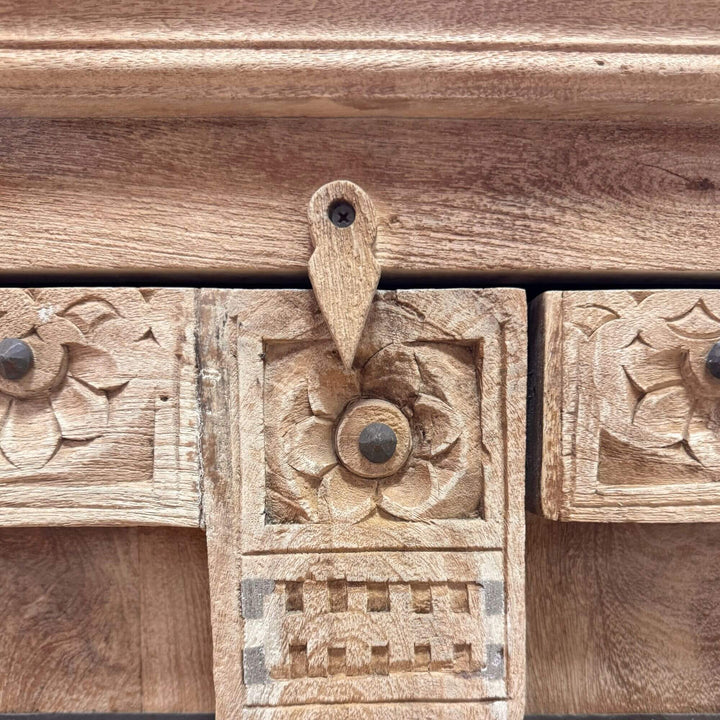 Close-up of the carved wooden door and metal ring handle on the Kasol Buffet.