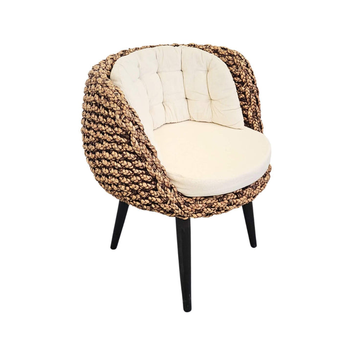Angled view natural rattan dining chair
