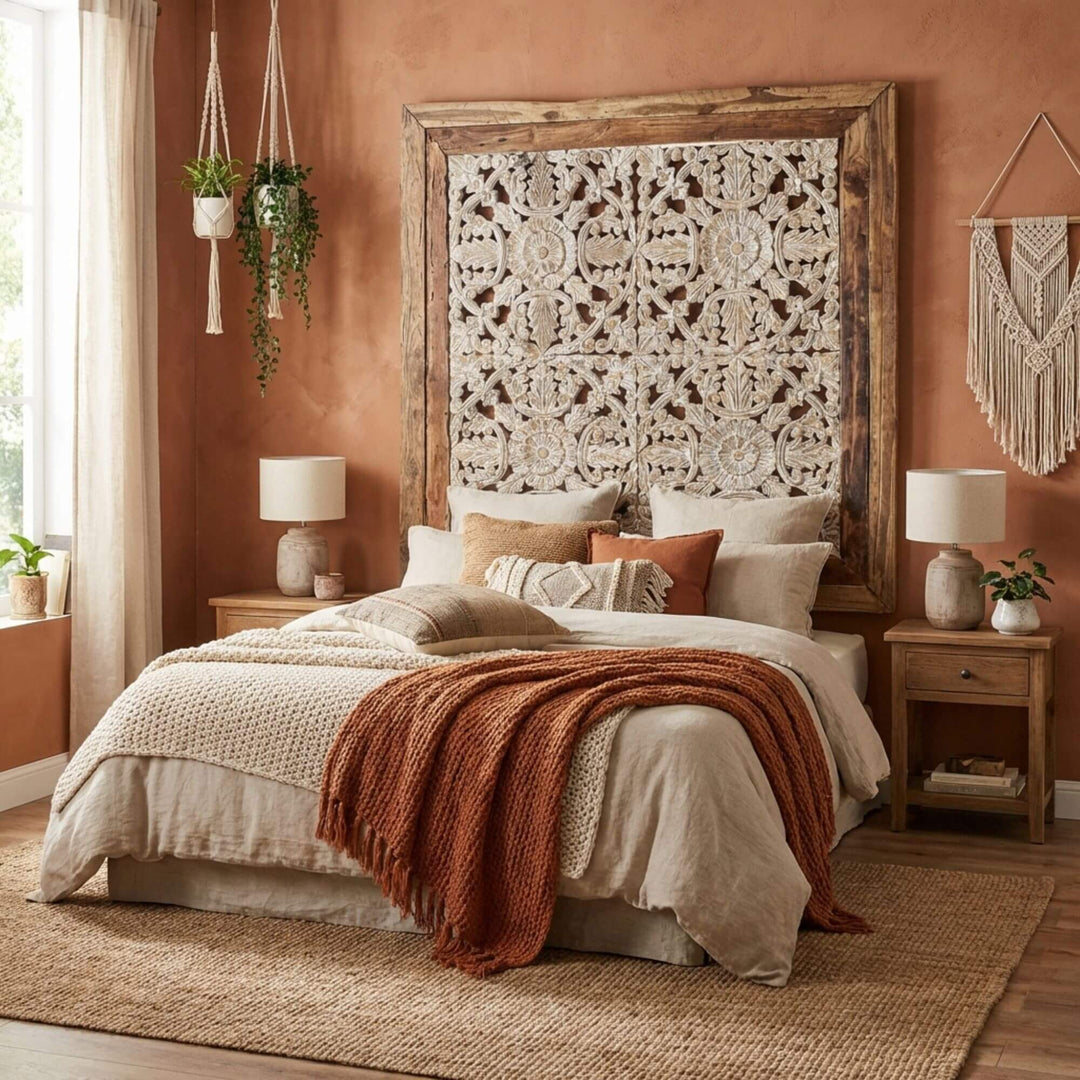 Bedroom with a large wooden Kavya wall panel headboard featuring intricate carvings, soft bedding, and decorative pillows.