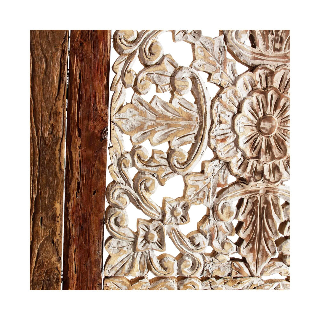 Close-up of rustic wooden headboard with intricate detailing and natural finish.