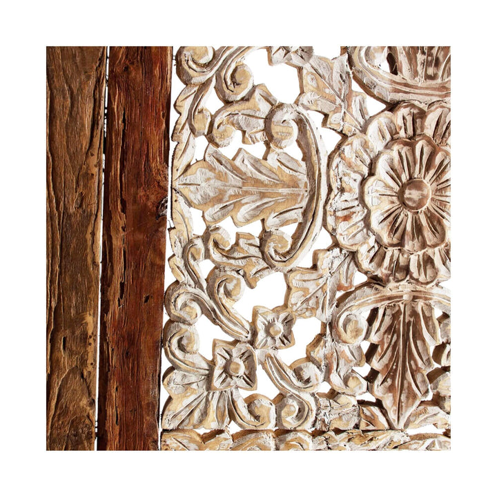 Close-up of rustic wooden headboard with intricate detailing and natural finish.