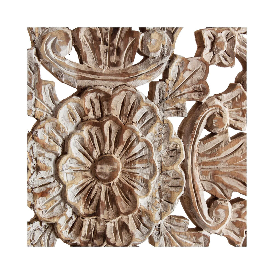 Close-up of wood wall panel with floral and leaf patterns