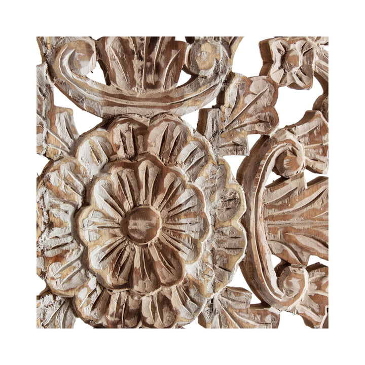 Close-up of wood wall panel with floral and leaf patterns