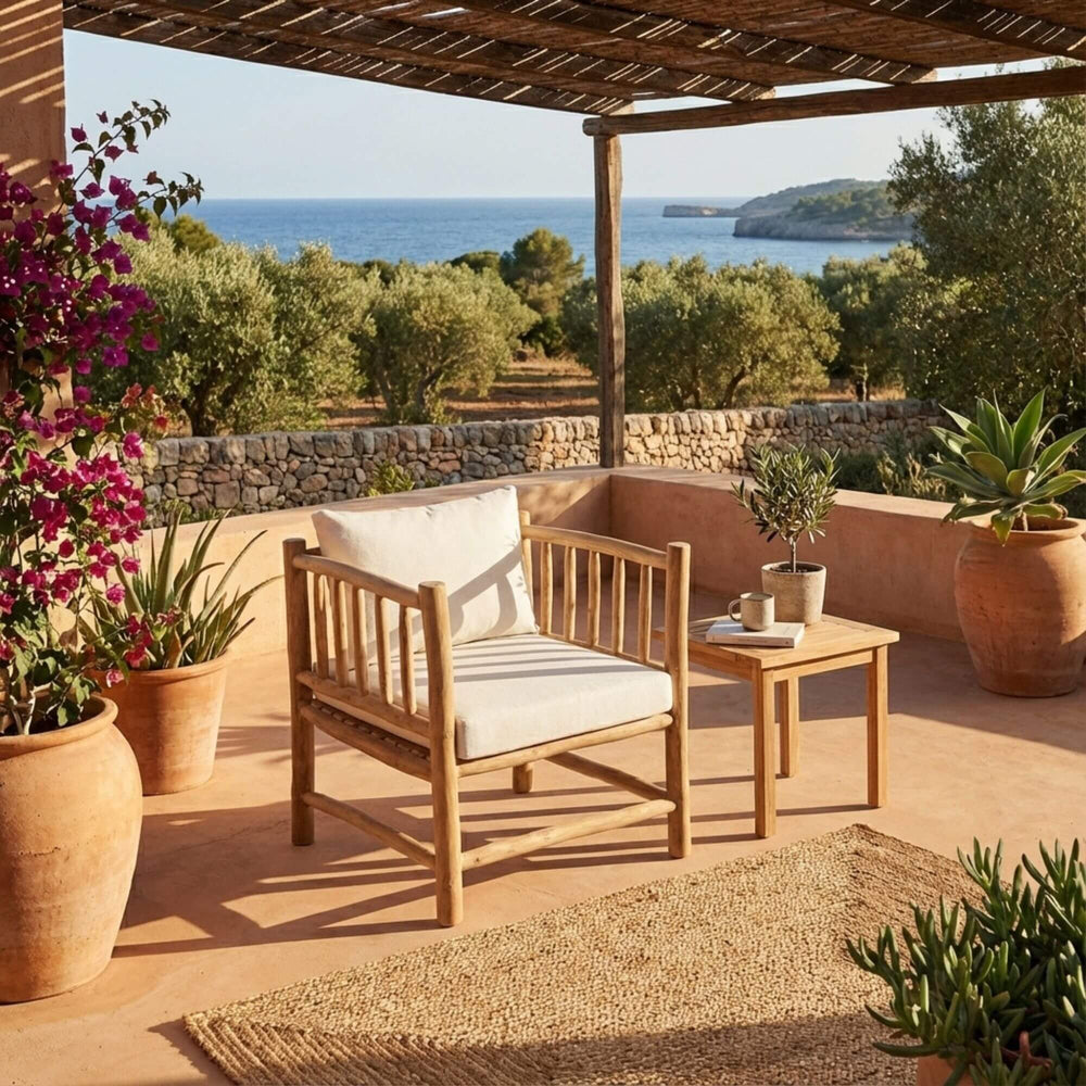 Styled terrace setting featuring the Kayu armchair in a relaxed outdoor environment.