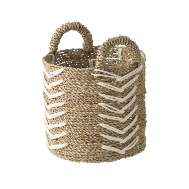 Handwoven raffia and cotton baskets used for home decor and storage.