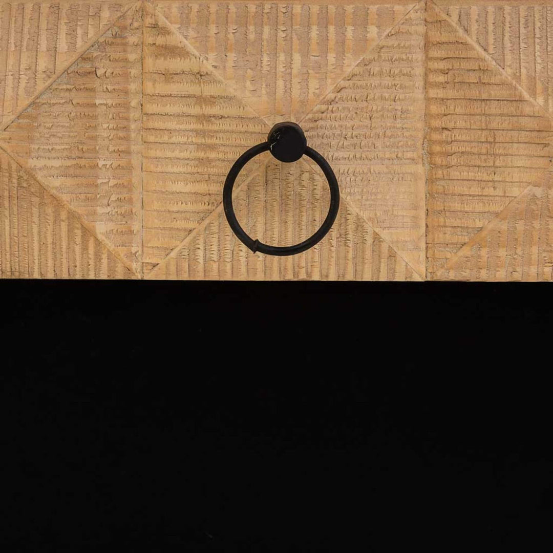 Detail of hand-carved wood pattern on table side