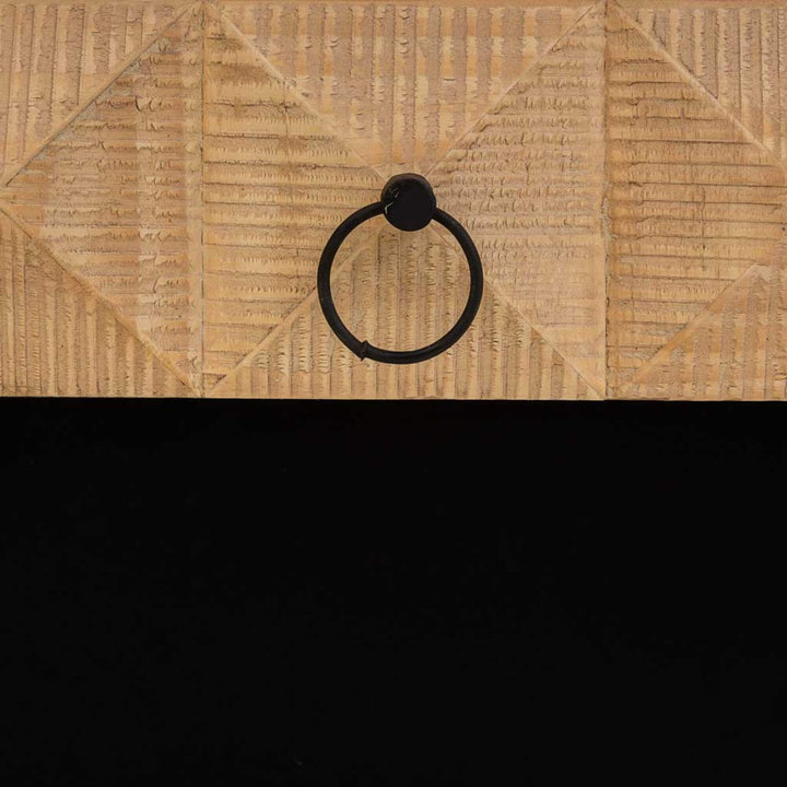 Detail of hand-carved wood pattern on table side
