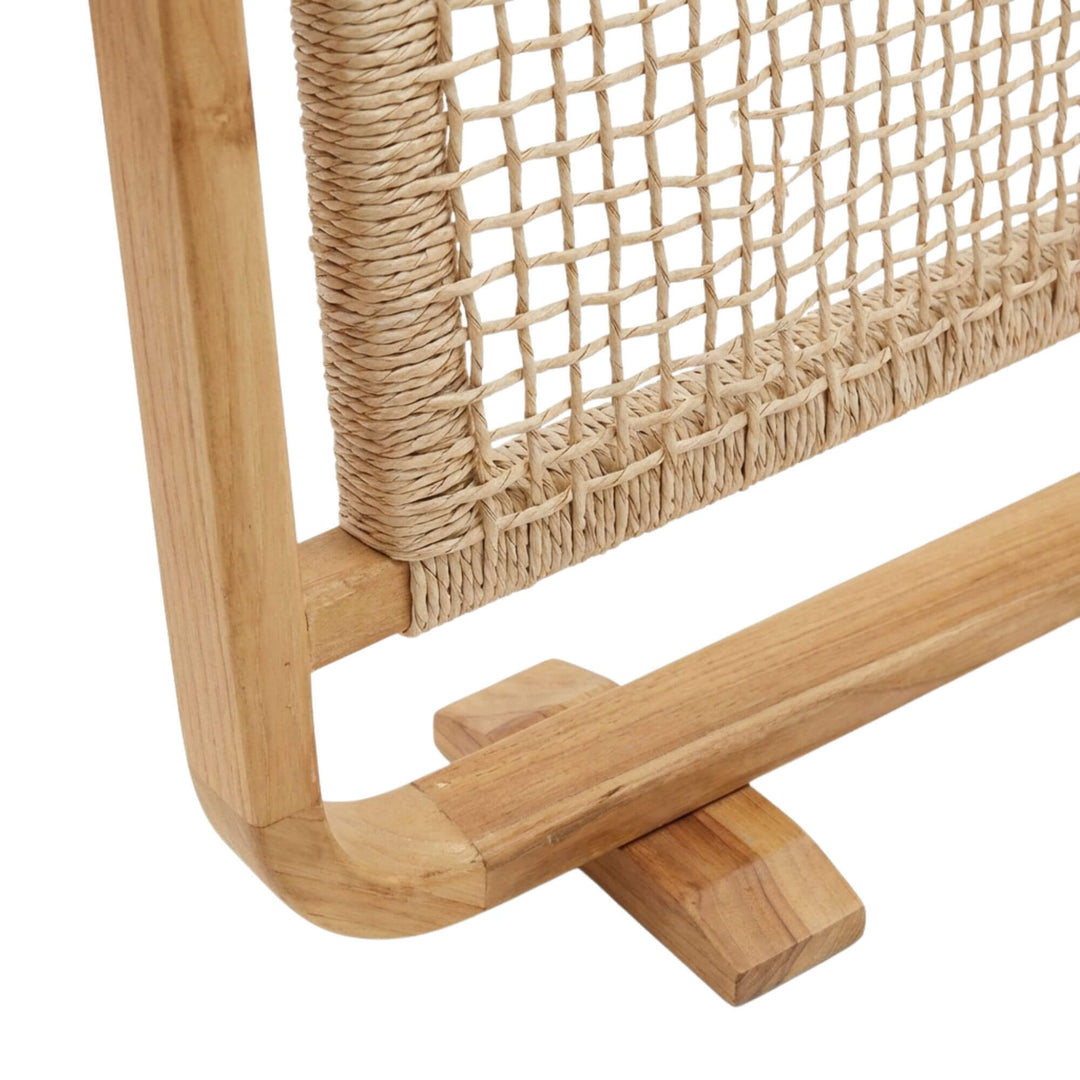 Detail view of the curved teak wood base and craftsmanship.