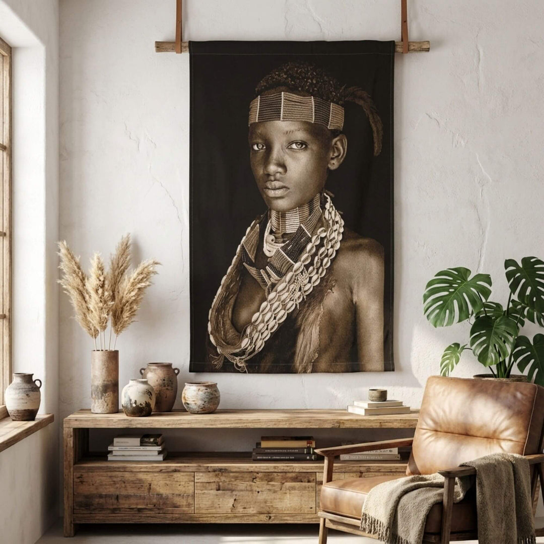 Interior styling scene with the Kofi Boy tapestry displayed above a wooden sideboard.