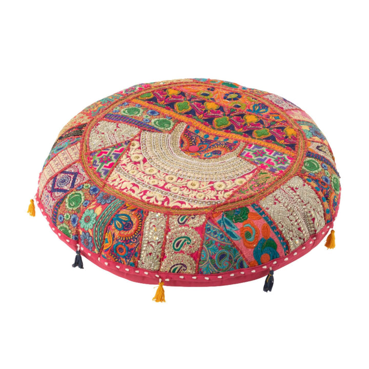 Pink KOOD floor pouf variant with tassel accents.