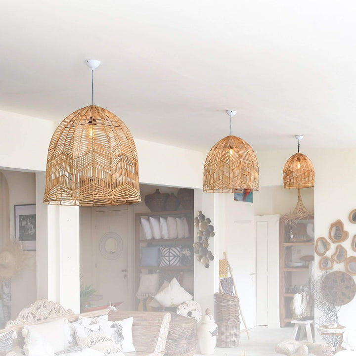 Room scene with three Kos rattan dome ceiling lamps in different sizes.