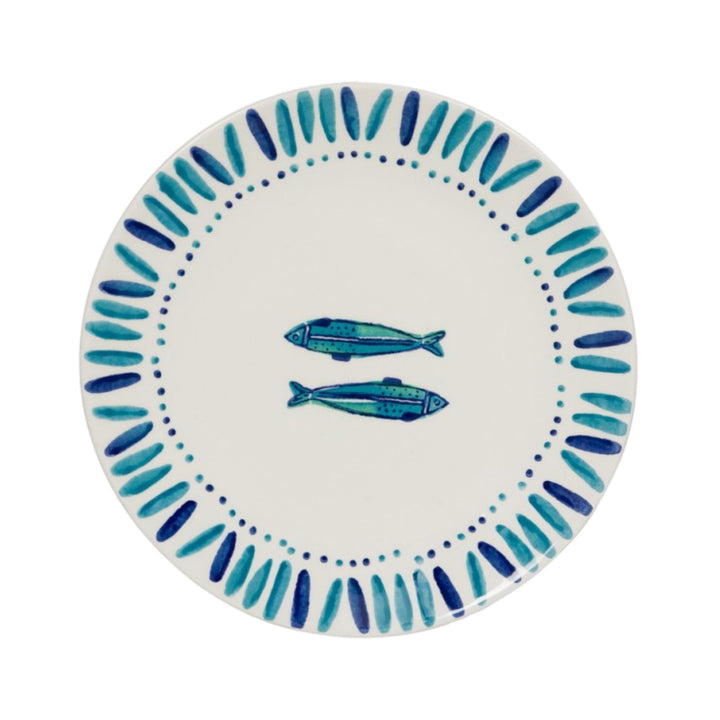 Top view of a Kyanos ceramic plate with two blue fish motifs and a hand-painted blue border