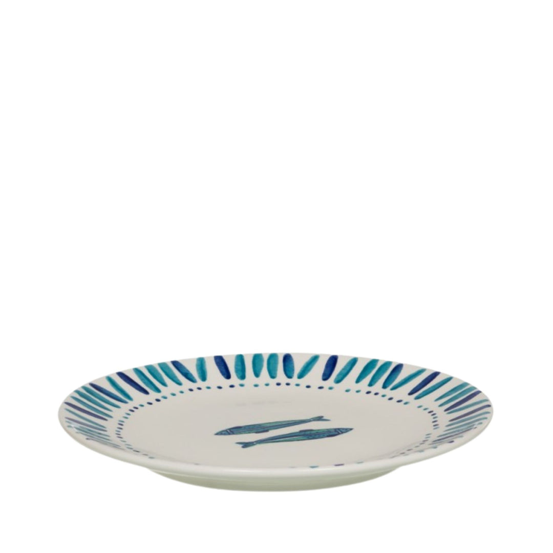 Side view of a Kyanos ceramic plate showing its shallow form and painted rim detail