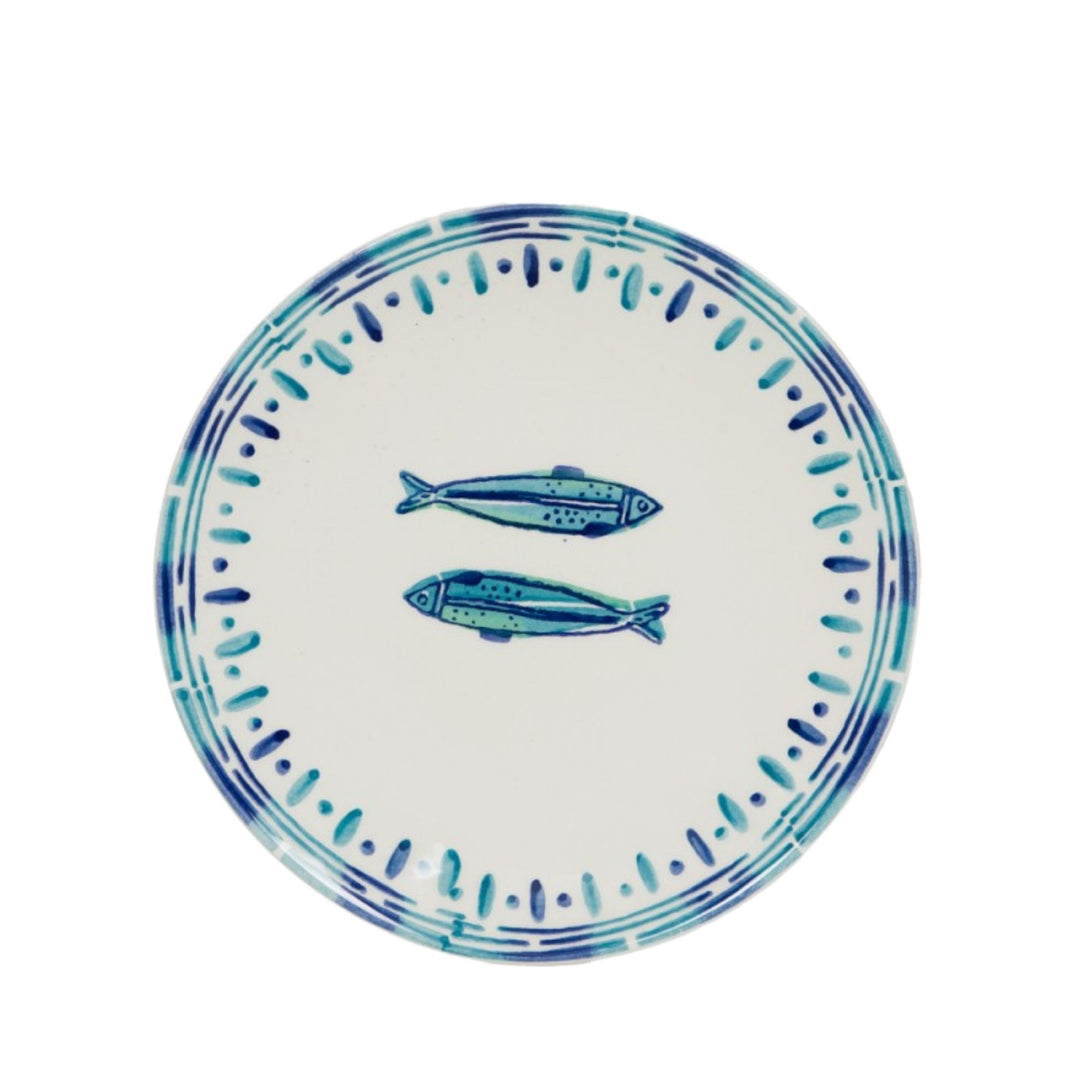 Top view of a Kyanos ceramic plate with twin fish motif and blue edge pattern