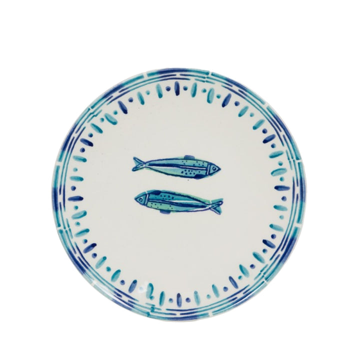 Top view of a Kyanos ceramic plate with twin fish motif and blue edge pattern