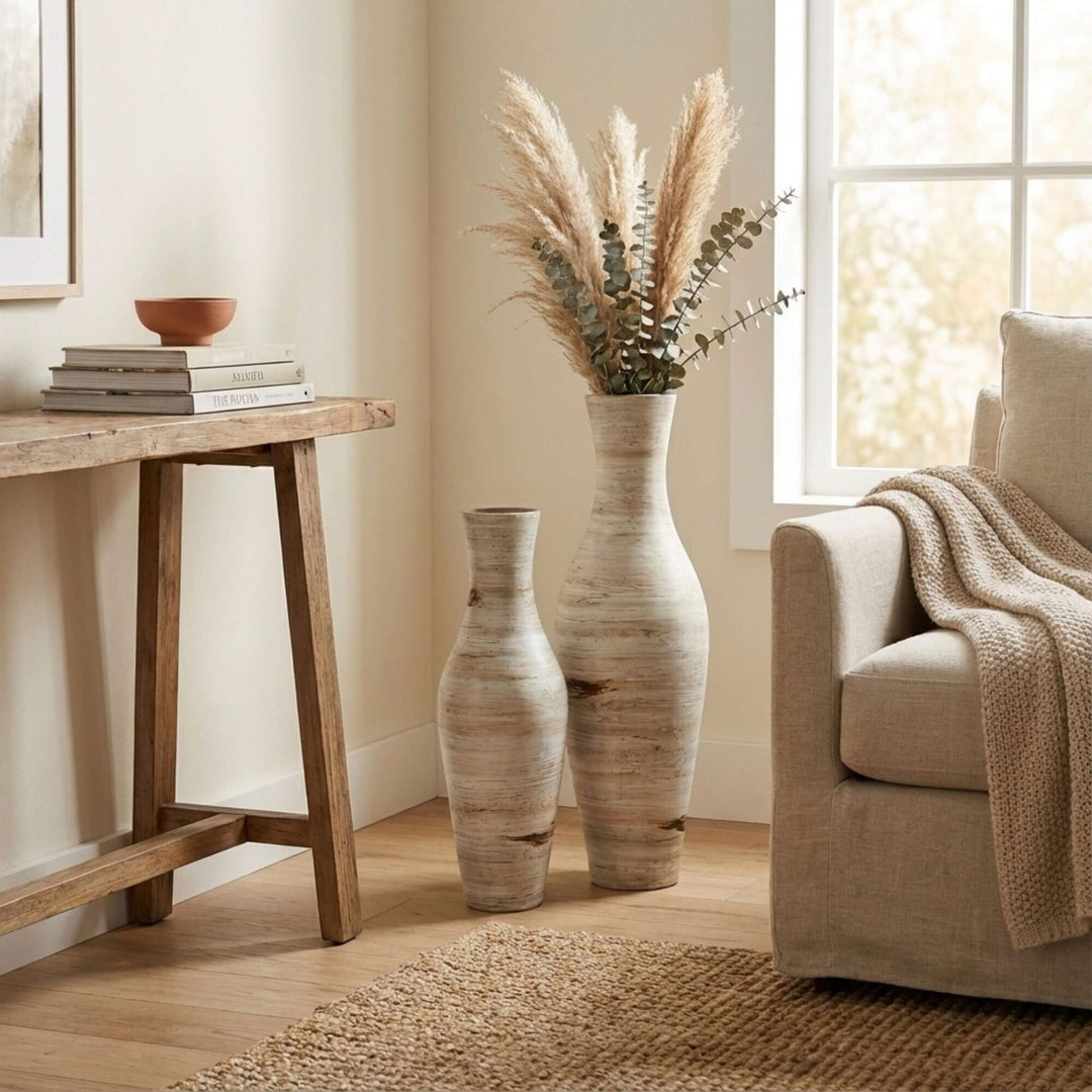 Styled interior setting with Labra terracotta pots placed beside a wooden console and sofa.