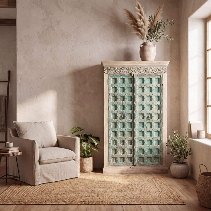 Lakshimi sheesham wood wardrobe styled in a warm neutral interior with decorative accessories and plants