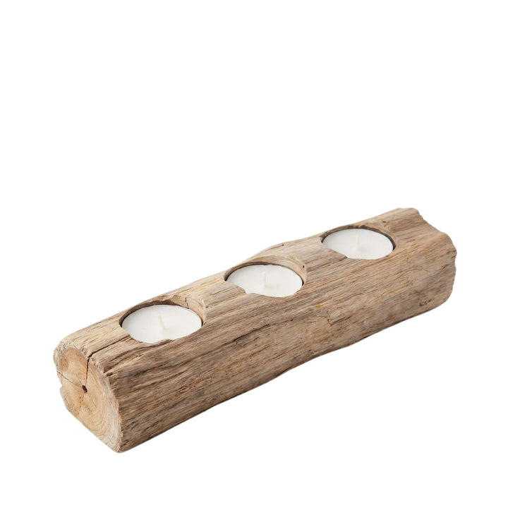 Front view of the Lami teak candle holder showcasing its elongated form and three candle openings.