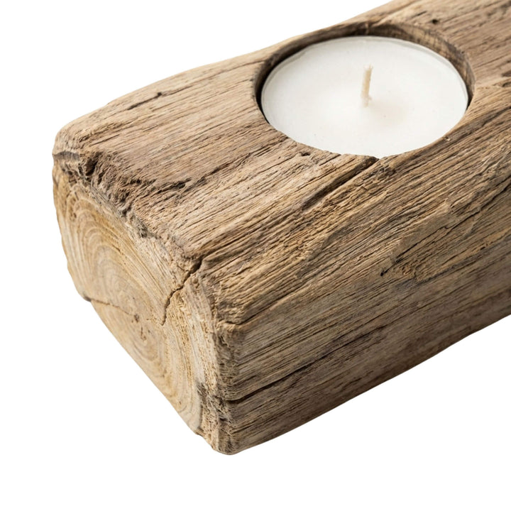 Close-up detail of the teak wood surface highlighting the natural grain and weathered texture.