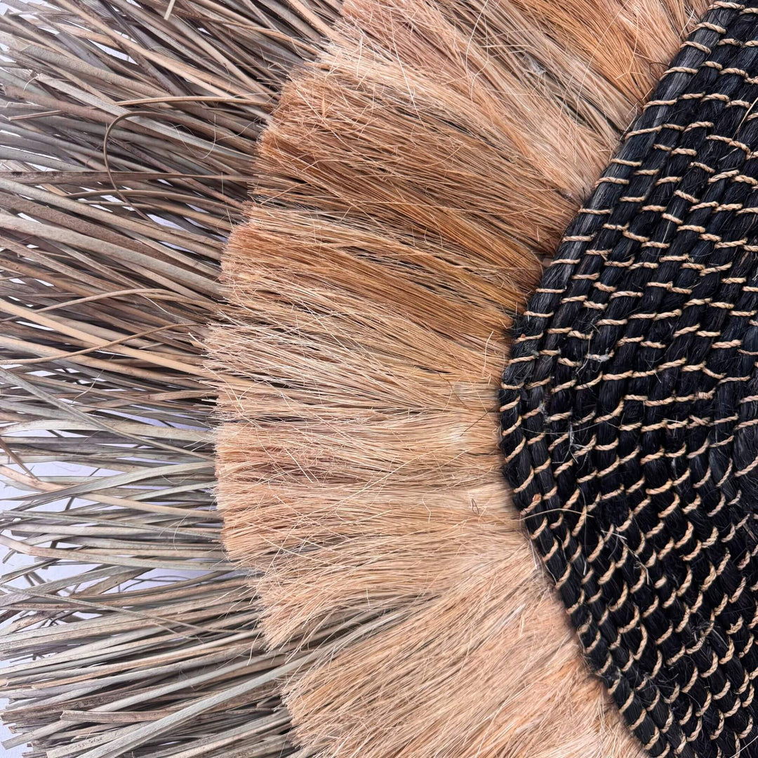 Close-up of the Laras Wall Deco showing layered natural fiber texture.