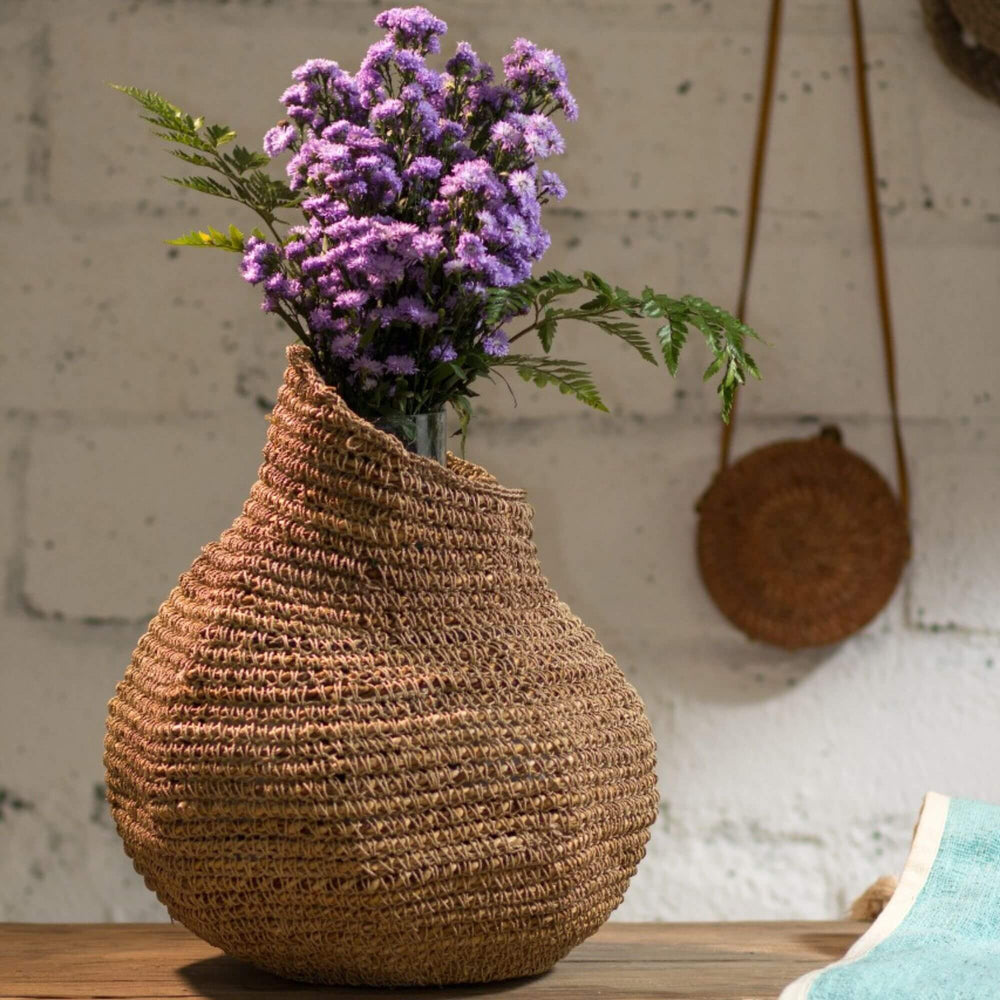 Laurent seagrass basket styled with dried flowers on a console