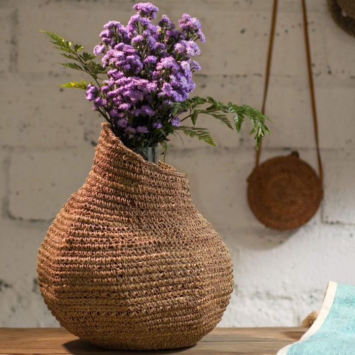 Laurent seagrass basket styled with dried flowers on a console