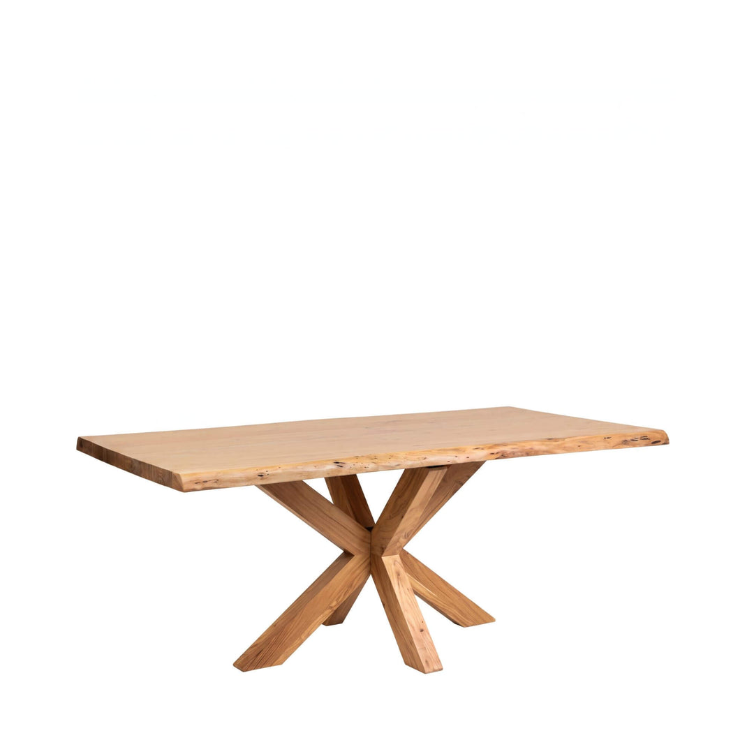 Lea dining table shown in a smaller size with natural acacia wood top and crossed-leg base