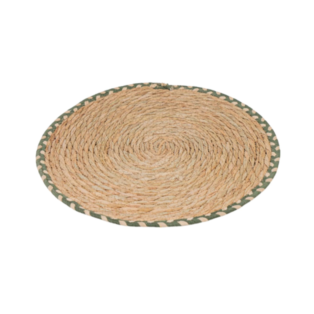 Front view of the Legundi Table Mat made of woven natural fibers with green border.