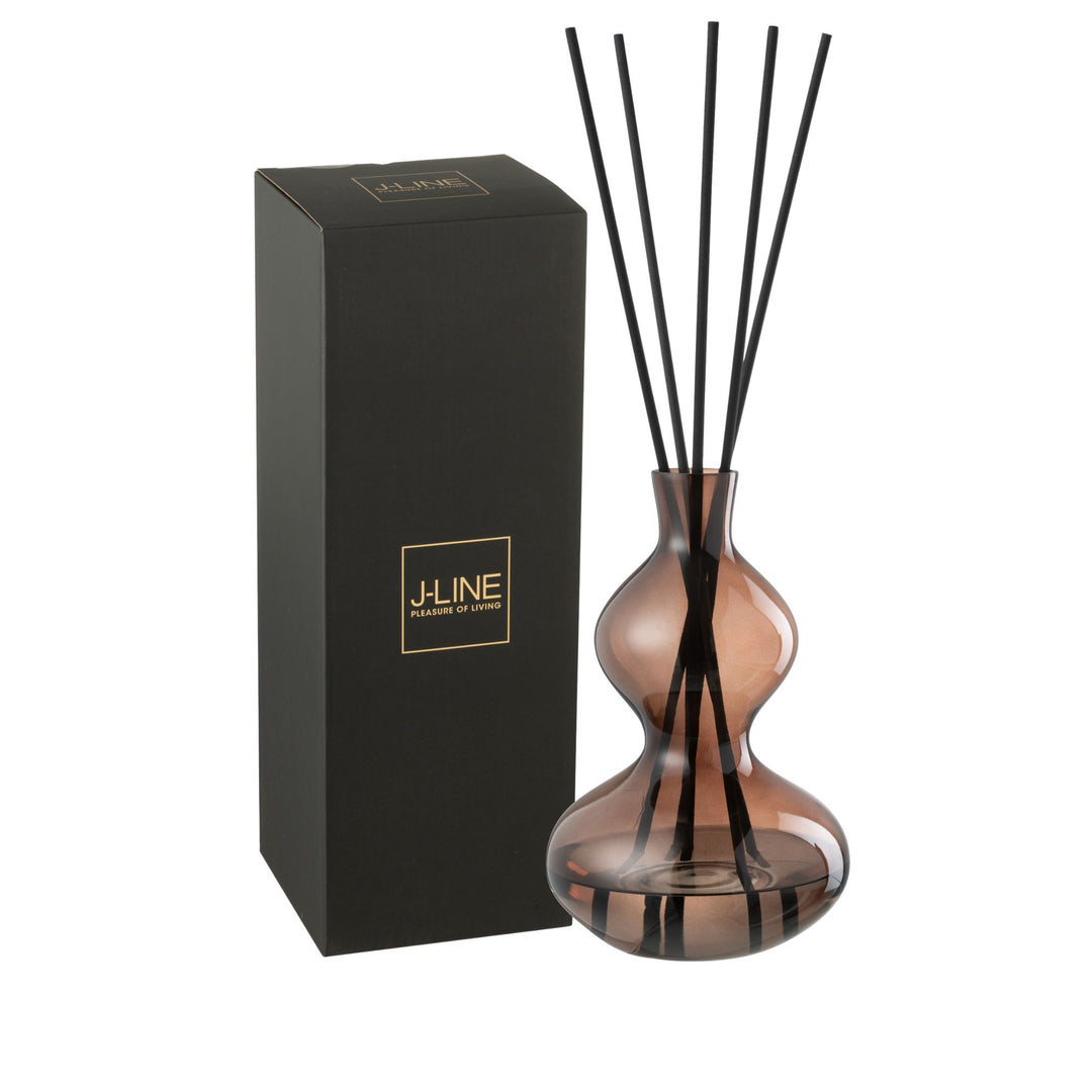 Diffuser with packaging featuring the Lily Land amber glass bottle and black reeds.