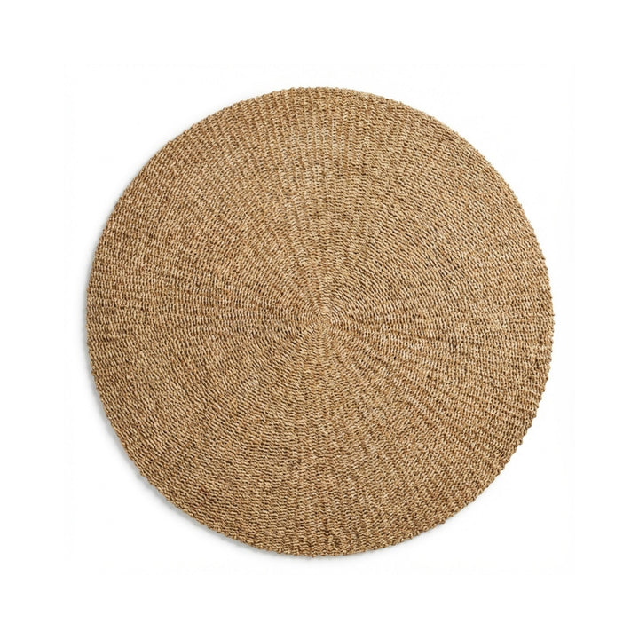 Front view of the Lombok round rug handcrafted from natural palm leaf fibers.