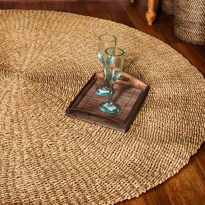 Styled interior scene featuring the Lombok palm leaf rug as a natural floor accent.