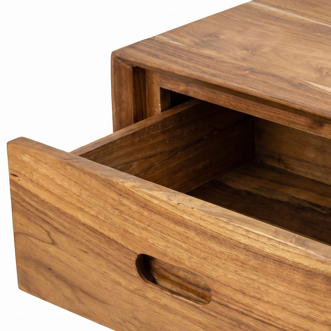 Close-up detail of the open drawer showing the teak wood grain and practical storage space.