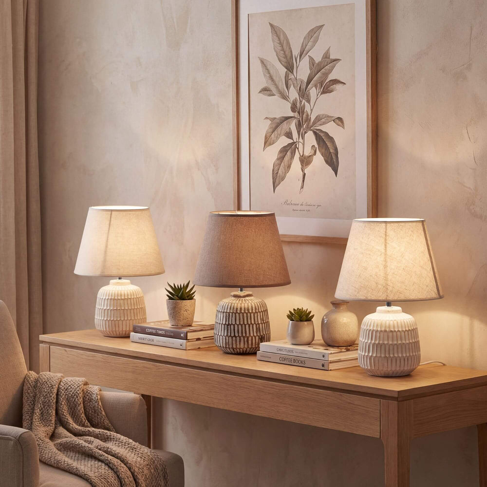 Styled interior setting featuring Luma table lamps on a wooden console in a warm natural space.