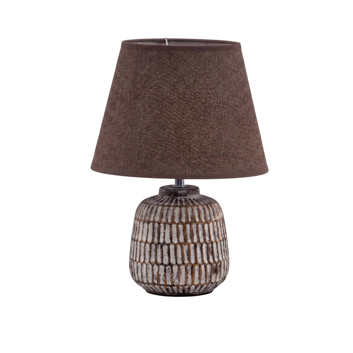Front view of the dark ceramic Luma lamp with a brown textile shade.
