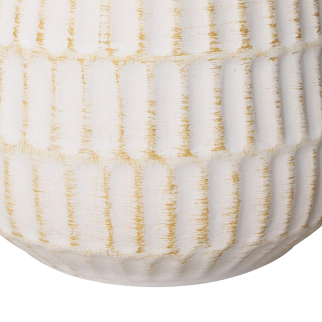 Close-up detail of the white ceramic base showing its textured glazed finish.