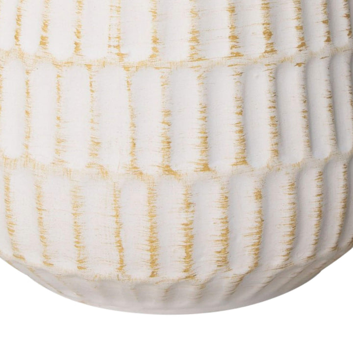Close-up detail of the white ceramic base showing its textured glazed finish.